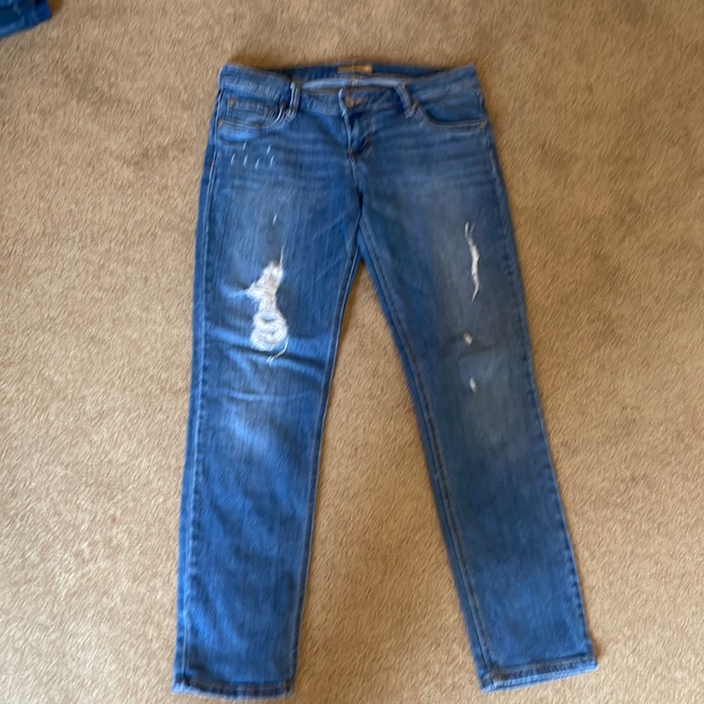 STS blue distressed, low rise, cropped ankle jeans.